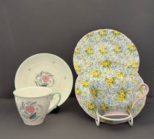 The coffee cup and saucer on the left is 'Serenity and Grey Crystals